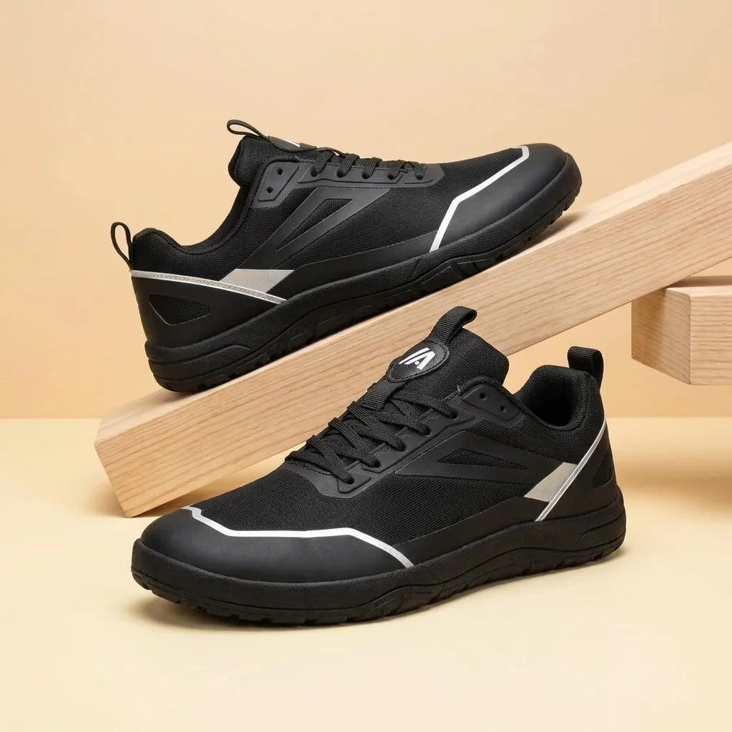 Alvidon AeroKnit Weiß – Barfußschuhe, Detailaufnahme des gestickten Alvidon-Logos, für Damen und Herren