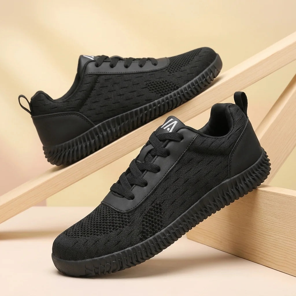 Alvidon PureStride Braun – Barfußschuhe, Detailaufnahme des gestickten Alvidon-Logos, für Damen und Herren