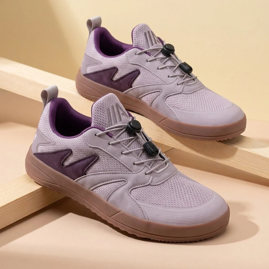 Alvidon TerraLite Grau – Barfußschuhe, Detailaufnahme des gestickten Alvidon-Logos, für Damen und Herren