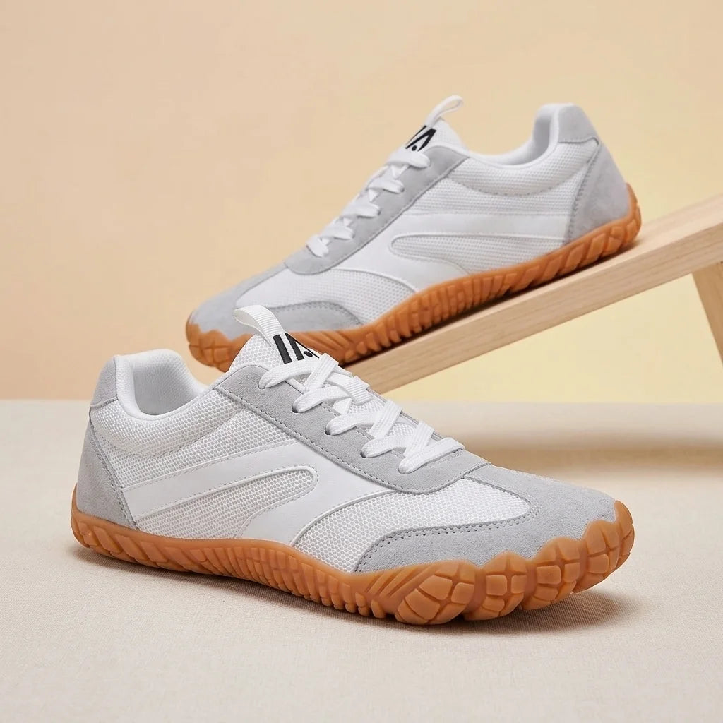 Alvidon ZenStride Dunkelgrau – Barfußschuhe, Detailaufnahme des gestickten Alvidon-Logos, für Damen und Herren